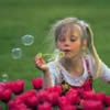 Child blowing bubbles