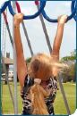 Child on monkey bars